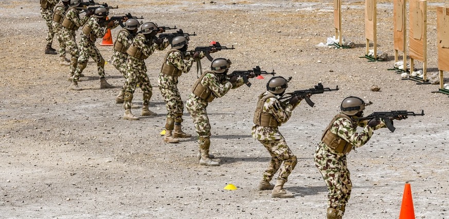 Soldiers in a line during marksmanship training on a firing range