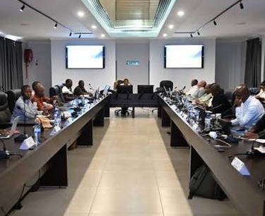 ACE leadership team in a boardroom meeting on defence and security programme delivery